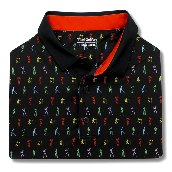 A close up of a black performance golf polo with red trim around the collar, and a pattern of colorful stick figure golfers.